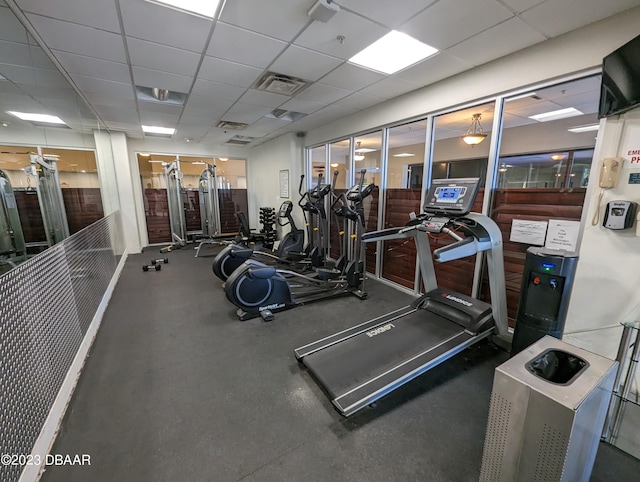 workout area with a drop ceiling