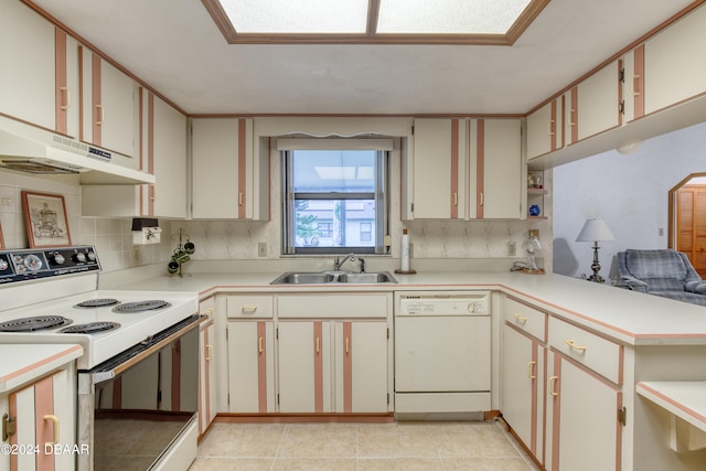 kitchen with white cabinetry, sink, kitchen peninsula, light tile patterned floors, and white appliances