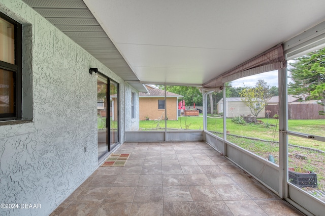 unfurnished sunroom featuring a wealth of natural light