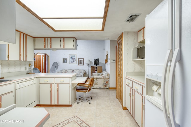 kitchen featuring white cabinetry, kitchen peninsula, light tile patterned flooring, and white appliances