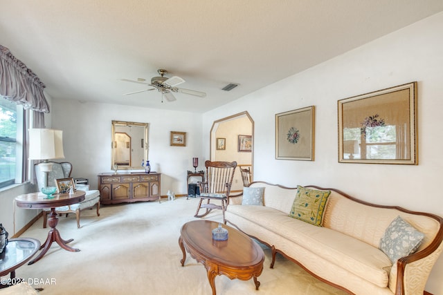 living room featuring ceiling fan and carpet floors