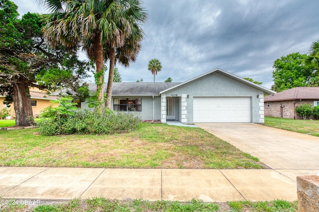 view of front of home featuring a garage and a front lawn