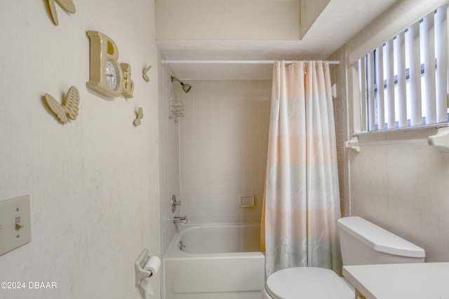 full bathroom with vanity, toilet, and shower / tub combo