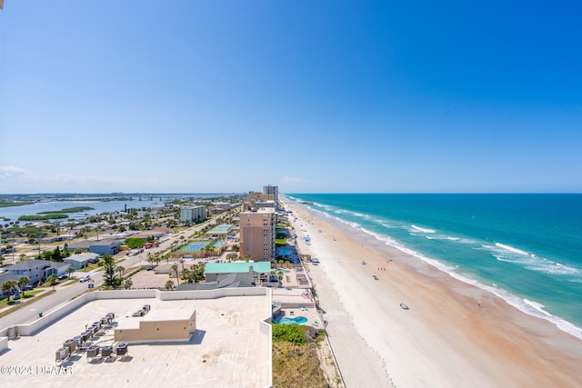 bird's eye view featuring a water view and a view of the beach