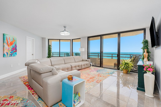 living room featuring floor to ceiling windows and a healthy amount of sunlight