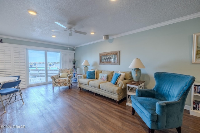 living room featuring crown molding, ceiling fan, wood-type flooring, and a textured ceiling