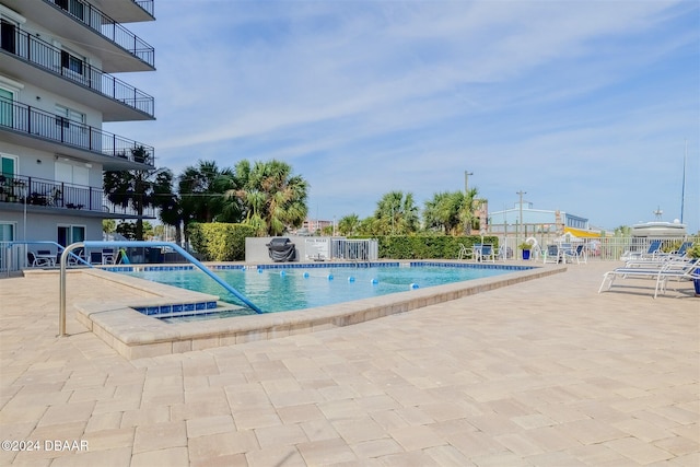 view of swimming pool with a patio area