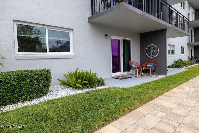 entrance to property with a yard