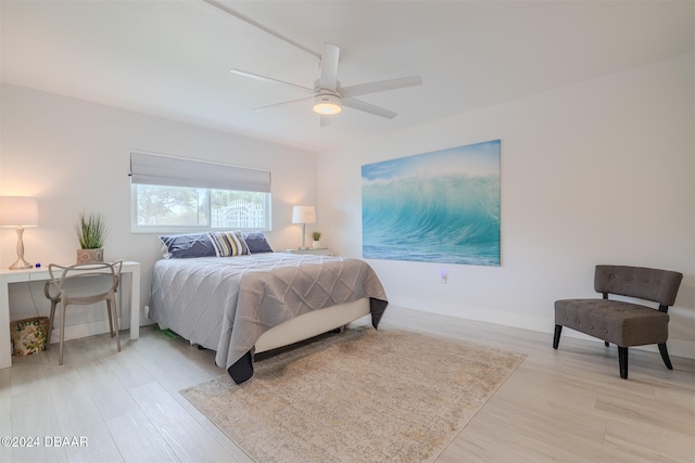 bedroom with light wood-type flooring and ceiling fan