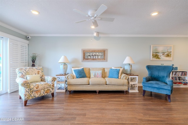 living room with ornamental molding, a textured ceiling, and hardwood / wood-style flooring