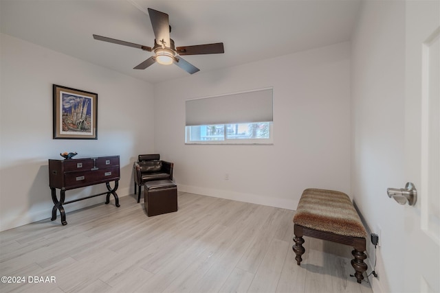 sitting room featuring light wood-type flooring and ceiling fan