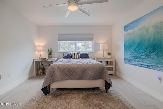 bedroom featuring ceiling fan and light hardwood / wood-style flooring