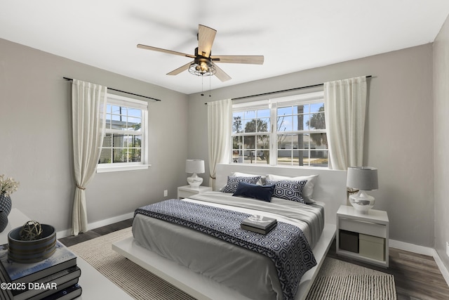 2711 Dach Ave, Daytona Beach, FL 32118 - bedroom with dark wood-type flooring, baseboards, and a ceiling fan