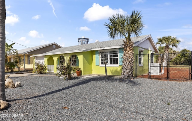 2711 Dach Ave, Daytona Beach, FL 32118 - ranch-style house featuring a chimney, fence, a gate, and stucco siding