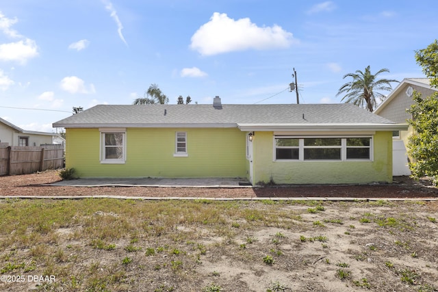 2711 Dach Ave, Daytona Beach, FL 32118 - rear view of property with fence and stucco siding