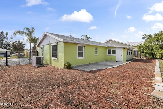 2711 Dach Ave, Daytona Beach, FL 32118 - rear view of house featuring fence and a patio area