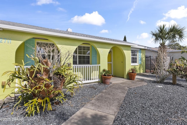 2711 Dach Ave, Daytona Beach, FL 32118 - view of front facade featuring a porch and stucco siding