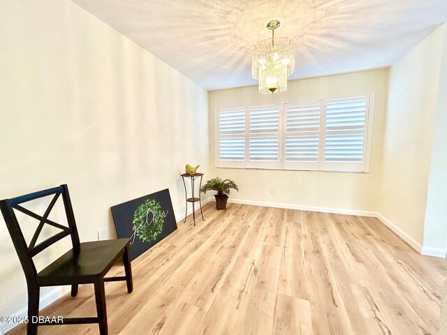 unfurnished bedroom featuring ceiling fan, light hardwood / wood-style flooring, and two closets