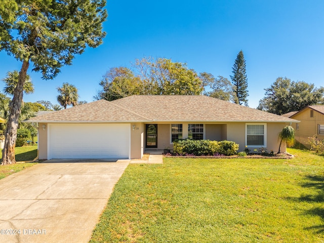 single story home with a front yard and a garage