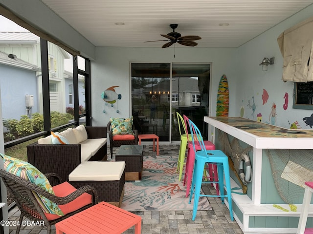 sunroom / solarium with ceiling fan