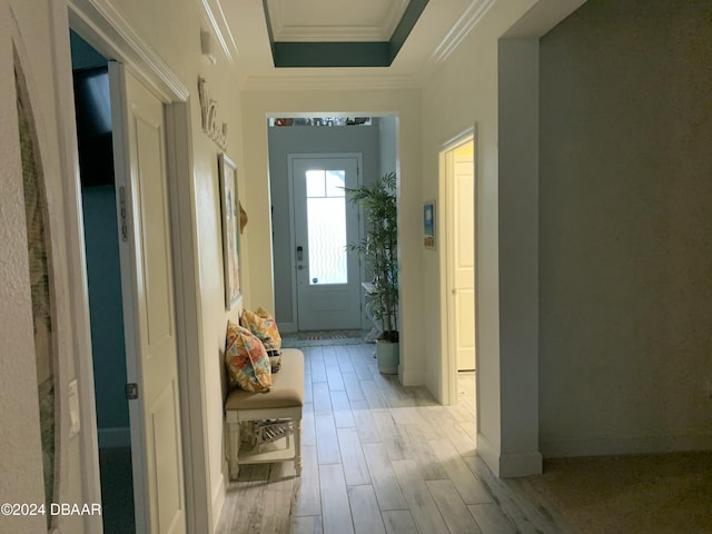 hallway featuring light hardwood / wood-style floors and ornamental molding