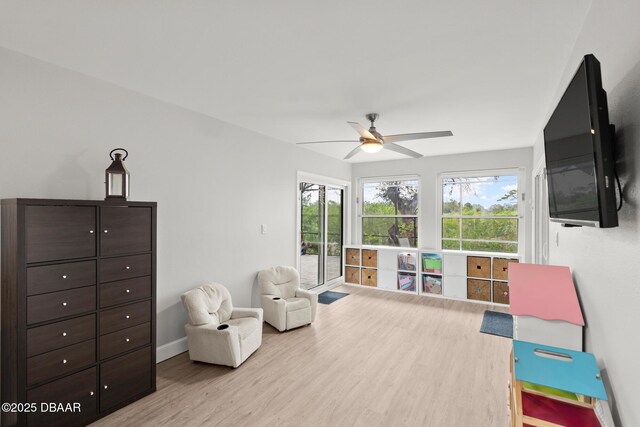 interior space featuring ceiling fan and light wood-type flooring