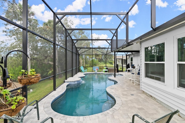 view of swimming pool featuring a lanai and a patio area