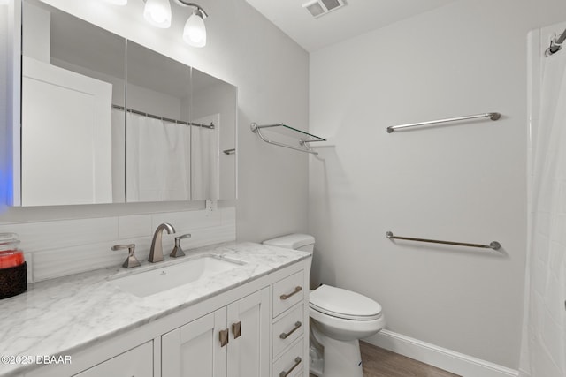 bathroom featuring vanity, decorative backsplash, toilet, curtained shower, and wood-type flooring