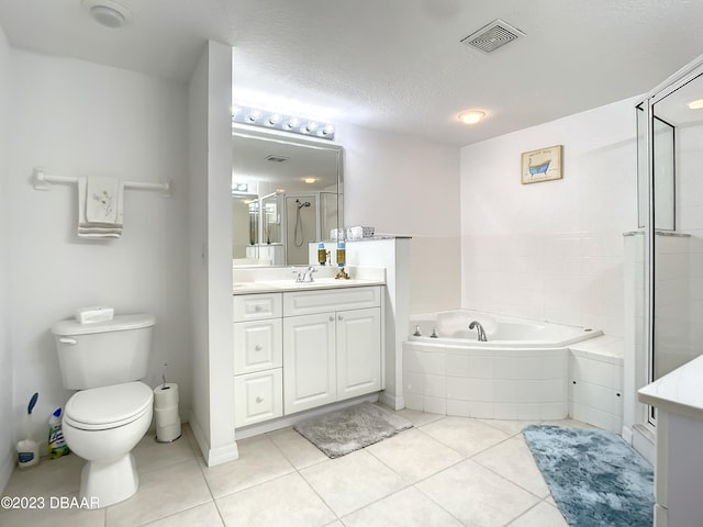 full bathroom with tile patterned flooring, vanity, a textured ceiling, and toilet