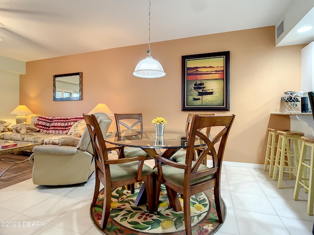 dining area with light tile patterned flooring