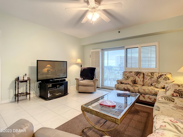 tiled living room featuring ceiling fan