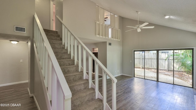 201 Pine Cone Trl, Ormond Beach, FL 32174 - staircase featuring a ceiling fan, a textured ceiling, baseboards, and wood finished floors