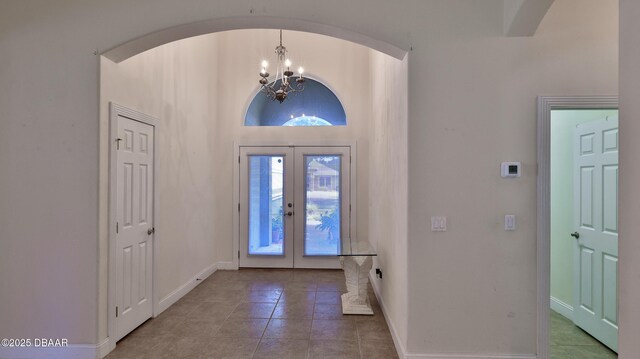 4269 Mayfair Ln, Port Orange, FL 32129 - tiled entryway with a chandelier and french doors