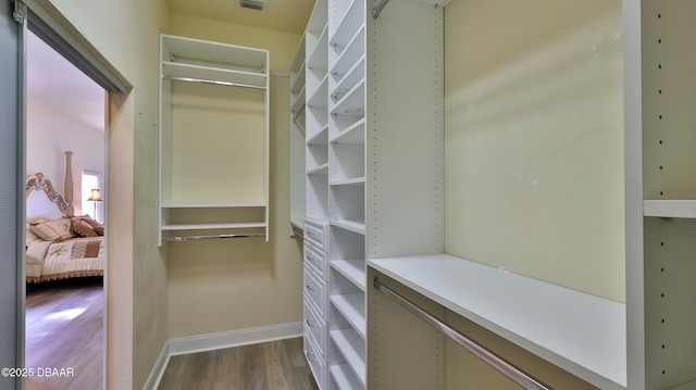 4269 Mayfair Ln, Port Orange, FL 32129 - walk in closet featuring dark wood finished floors