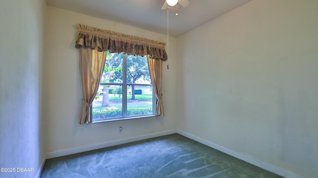 4269 Mayfair Ln, Port Orange, FL 32129 - spare room featuring dark colored carpet and ceiling fan