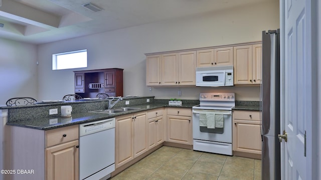 4269 Mayfair Ln, Port Orange, FL 32129 - kitchen with white appliances, a peninsula, light tile patterned flooring, and dark stone counters