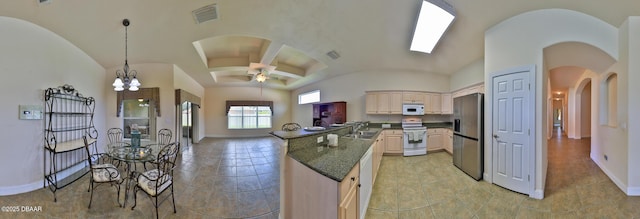 4269 Mayfair Ln, Port Orange, FL 32129 - kitchen with white appliances, arched walkways, lofted ceiling, light tile patterned floors, and pendant lighting