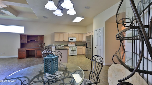 4269 Mayfair Ln, Port Orange, FL 32129 - dining space featuring a chandelier and light tile patterned flooring
