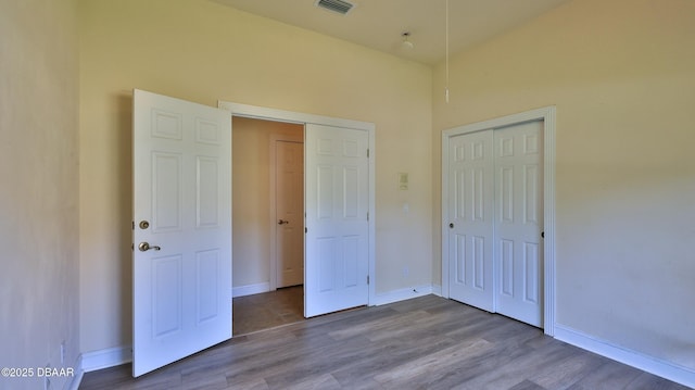 4269 Mayfair Ln, Port Orange, FL 32129 - unfurnished bedroom featuring wood finished floors and a closet