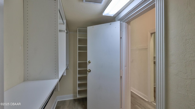 4269 Mayfair Ln, Port Orange, FL 32129 - spacious closet with wood finished floors