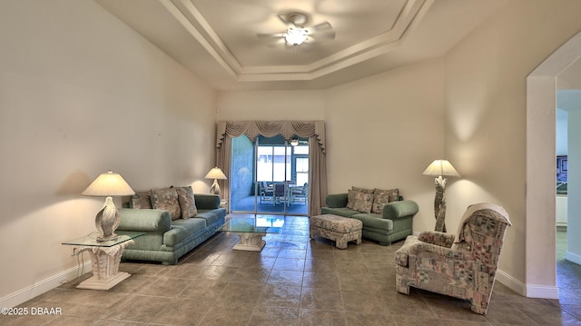 4269 Mayfair Ln, Port Orange, FL 32129 - tiled living room with a ceiling fan and a raised ceiling
