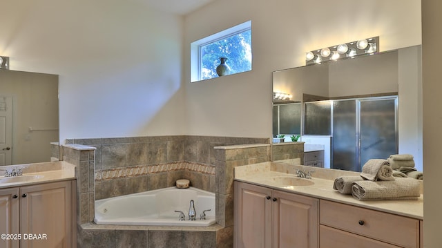 4269 Mayfair Ln, Port Orange, FL 32129 - full bathroom featuring two vanities, a garden tub, and a stall shower