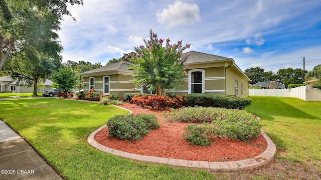 4269 Mayfair Ln, Port Orange, FL 32129 - view of front of house with stucco siding and roof with shingles