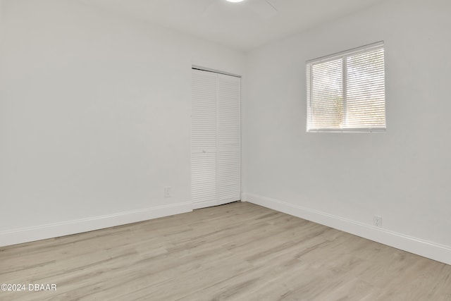 empty room with light hardwood / wood-style flooring