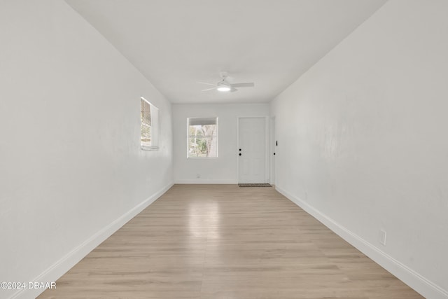 unfurnished room with ceiling fan and light hardwood / wood-style flooring