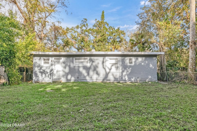 view of outdoor structure with a lawn