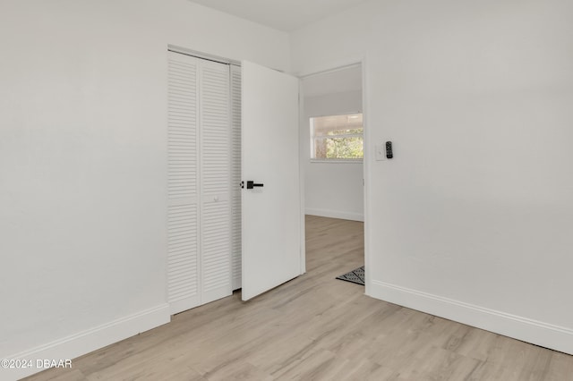 unfurnished room featuring light wood-type flooring