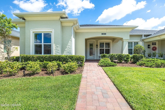 3402 Torre Blvd, New Smyrna Beach, FL 32168 - view of front of property featuring stucco siding and a front lawn