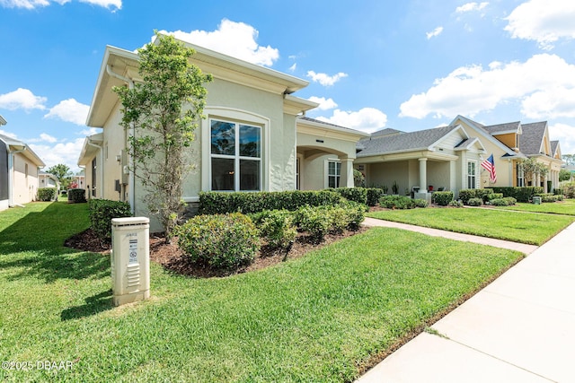 3402 Torre Blvd, New Smyrna Beach, FL 32168 - mediterranean / spanish home with stucco siding and a front lawn
