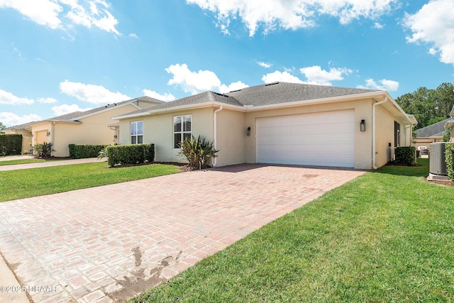 3402 Torre Blvd, New Smyrna Beach, FL 32168 - single story home with a garage, decorative driveway, stucco siding, a front lawn, and cooling unit